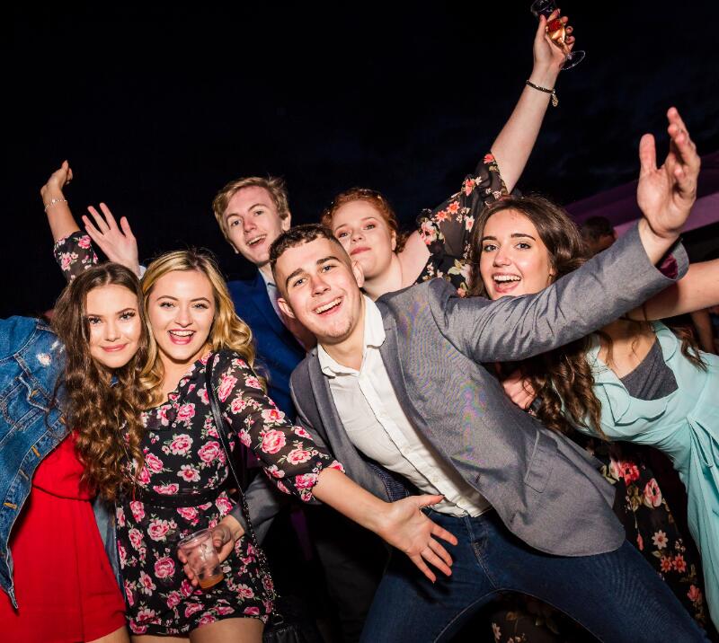 A big group of young race goers pose for pictures at Sedgefield