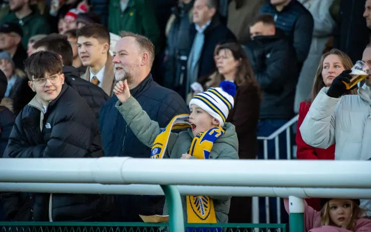 A young boy in the crowd at Sedgefield cheers the race